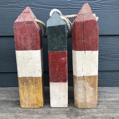 Early primitive wooden buoys - primitive,
