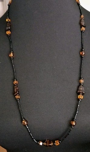 Black amber colour beaded - &,