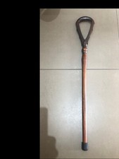 Closed handle carved hardwood walking stick with unusual oval shaft