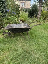 Antique tin mining wheelbarrow garden planter 