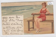 GLAMOUR / SEASIDE Woman in Red Bathing Costume sitting on bench    / VIGNETTE  