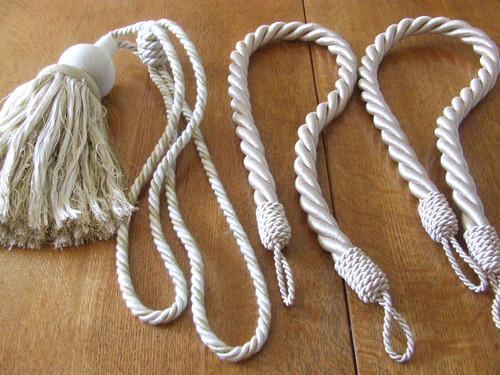 Pair cream tie backs 1 - 1, of