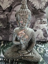 Silver seated buddha figurine