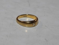 An 18ct gold diamond set gypsy  ring, size K/L, approx. 3.8gms total weight