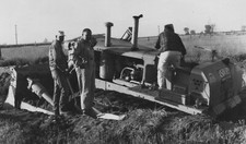 1950s Men Working Caterpillar