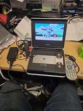 Phillips PET720 Portable DVD Player  White With Both Chargers/Remote/manual. 