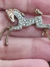 silver horse brooch gold on silver