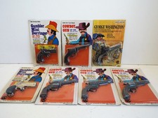 JOB LOT OF 7 X MINIATURE TOY CAP GUNS CARDED COWBOY GEORGE WASHINGTON  (WM954)
