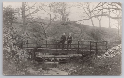 Rppc two men footbridge - men, on
