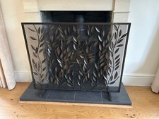Ornate metal fire screen with