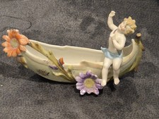 Antique Cherub In Canoe