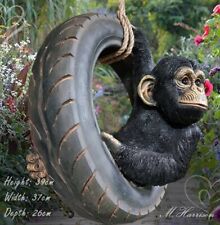 Chimpanzee on tyre rope swing