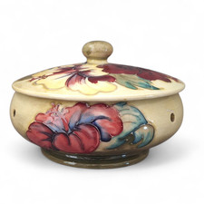 A MOORCROFT POT POURI COVERED BOWL IN THE CRIMSON HIBISCUS PATTERN