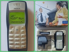 Nokia 1100 Collectors Mobile Phone (Unlocked). In retail box with content.
