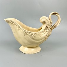 A late 18thc Leeds Pottery nautilus-shape creamware sauceboat c1770
