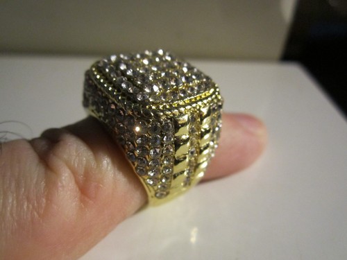 Heavy gold tone ring covered - heavy,