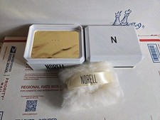 Norell Vintage Perfume Dusting