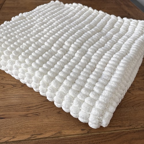 Hand knitted pom - hand,
