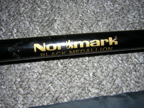 Nor mark black medallion - &,