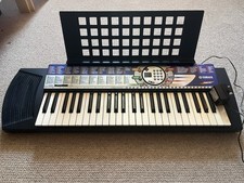 Blue Yamaha keyboard PSR 74