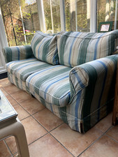 large used blue and white striped sofa