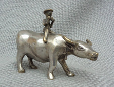 Antique silver metal Chinese man sitting riding a cow- buffalo statue sculpture