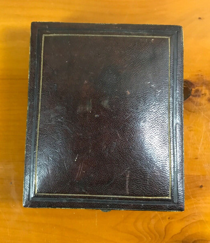 Antique leather pocket watch