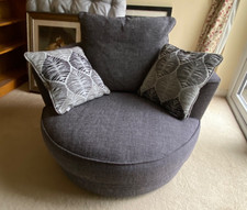 Swivel cuddle chair in grey