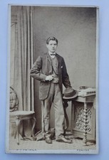 CDV OF HANDSOME YOUNG MAN HOLDING HAT, STUDIO PROPS, BY PATRICK OF FORFAR