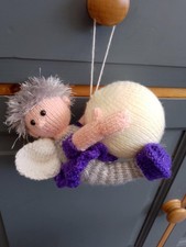 knitted fairy attached to a bauble. Christmas. Hand made in the UK