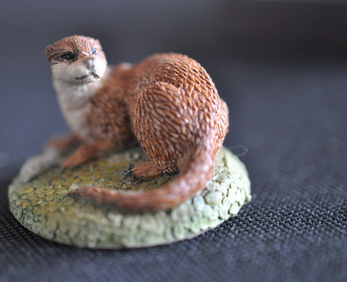 Otter with fish sculpture - otter,