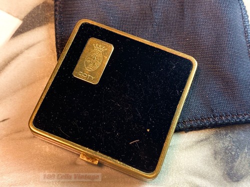 Coty small black and gold