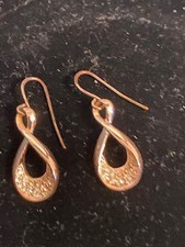 Attractive gold coloured drop earrings set with diamantes