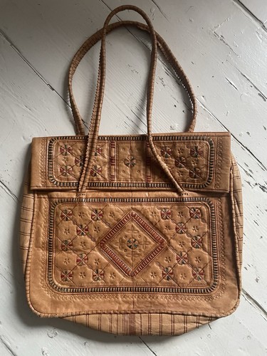 Hand tooled leather shoulder - hand,
