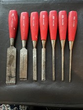 7 FOOTPRINT WOOD CHISELS IN VARIOUS CONDITIONS.