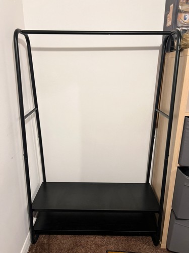 Black clothes rail with - rail, shoe