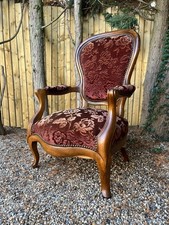 Antique Edwardian carved oak walnut floral fabric sprung fireside arm chair