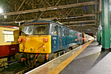 class 87 no 87002 in caledion sleeper at glasgow central