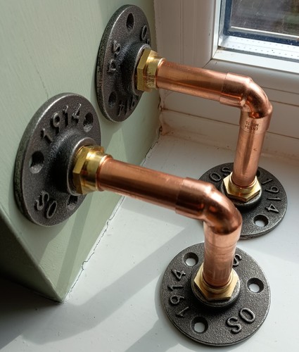 Two copper pipe shelf brackets - two,