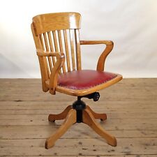 A fully-restored, Edwardian, oak, revolving, desk armchair, circa 1910