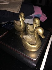 Three. Brass Swans