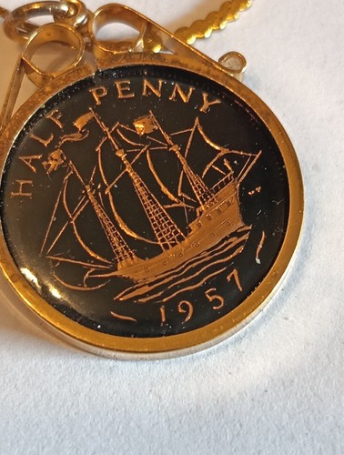 1957 enameled half penny - half,