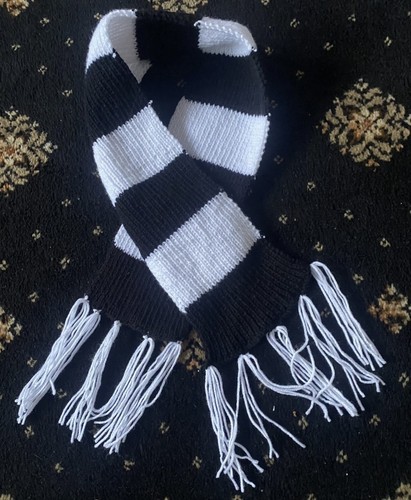 Hand knitted football scarves - hand,