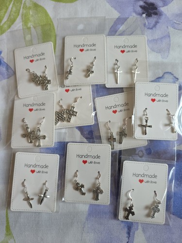 Joblot silver tone cross - of,