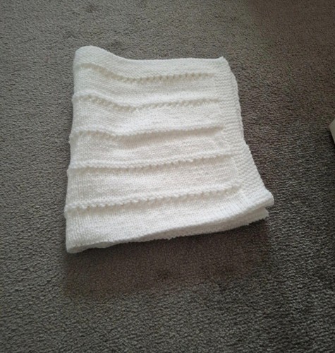 Hand knitted baby - hand,