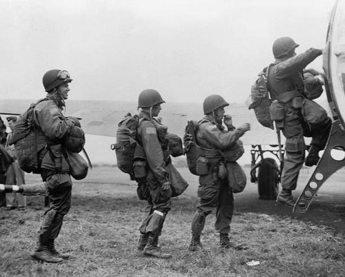 Army paratroopers climb into - , a