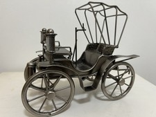 Metal early automobile or a horse-drawn carriage Model