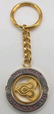 Thai Airways Intl, gold and silver tone spinner bag charm , keyring