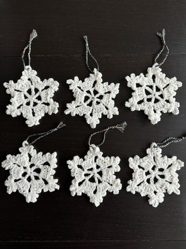 Six crocheted snowflakes - six,