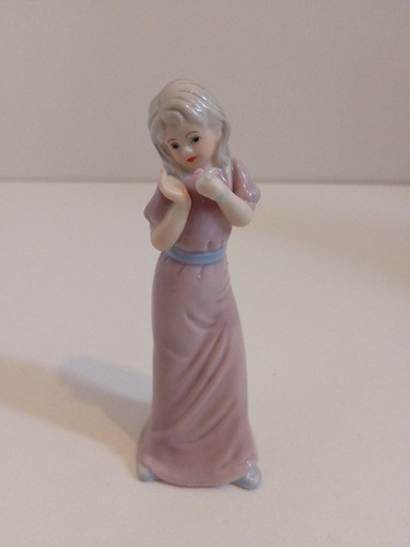 Porcelain figurine young - of, a